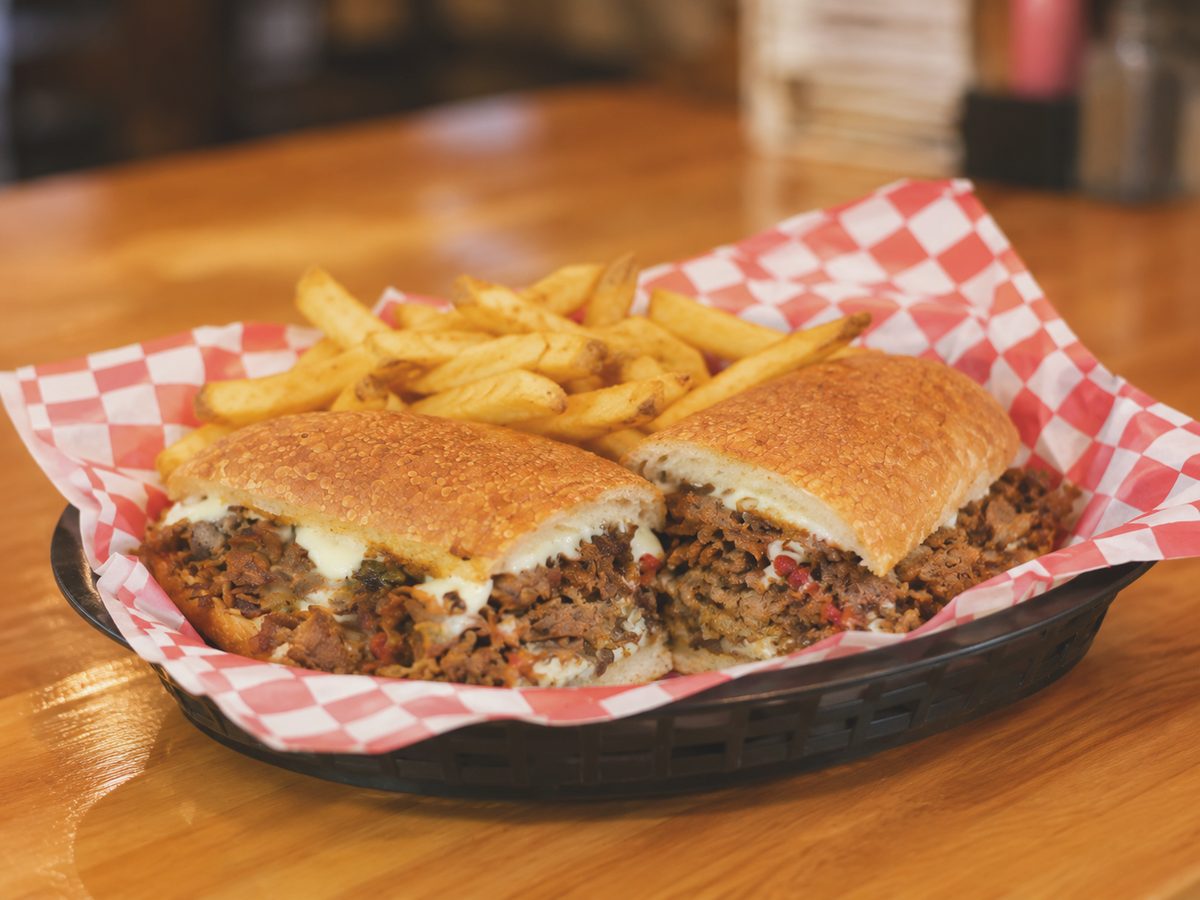Philly cheesesteak sub loaded with steak, peppers and melted cheese