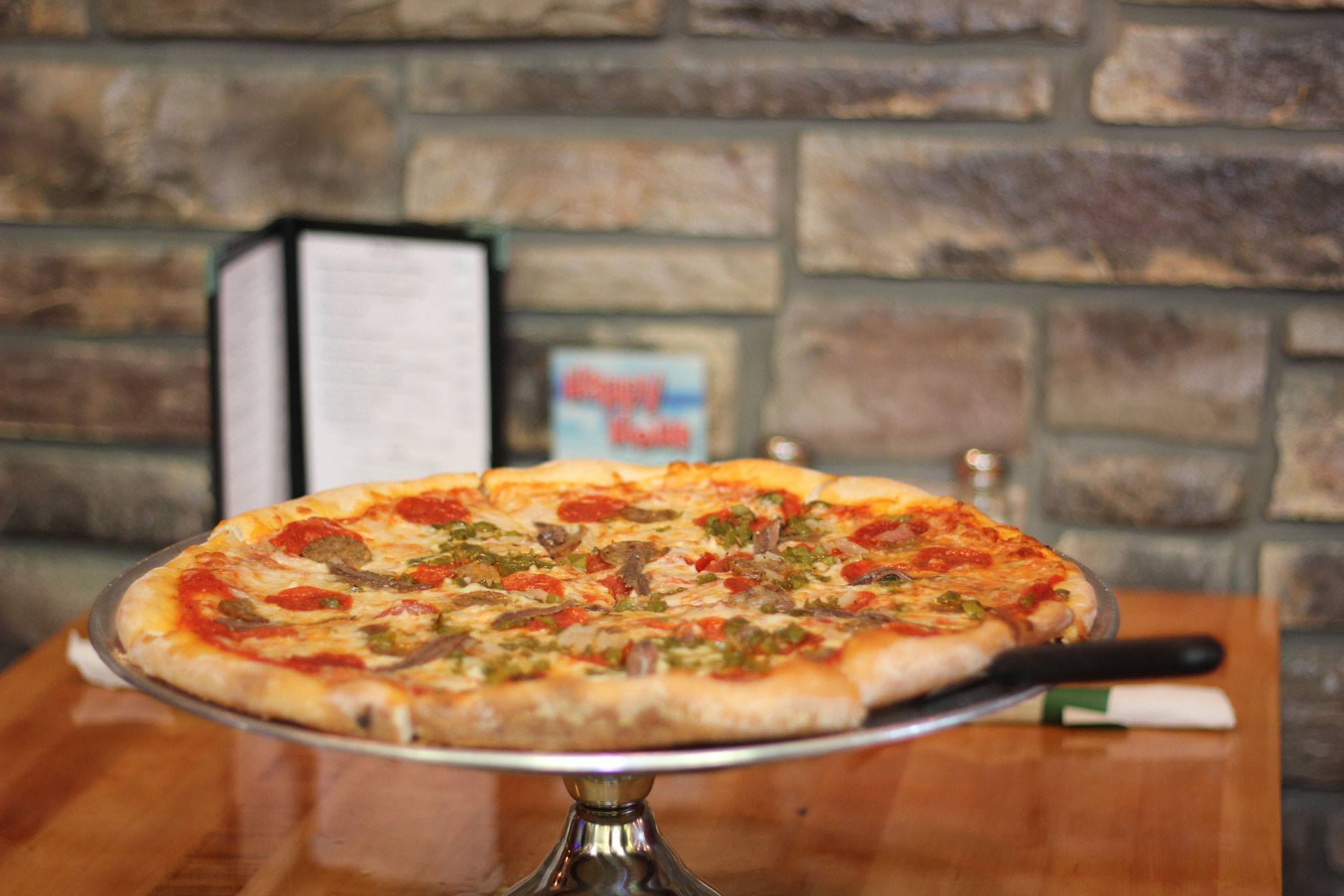A hand-tossed Bella Mozzarella pizza loaded with pepperoni, sausage and peppers